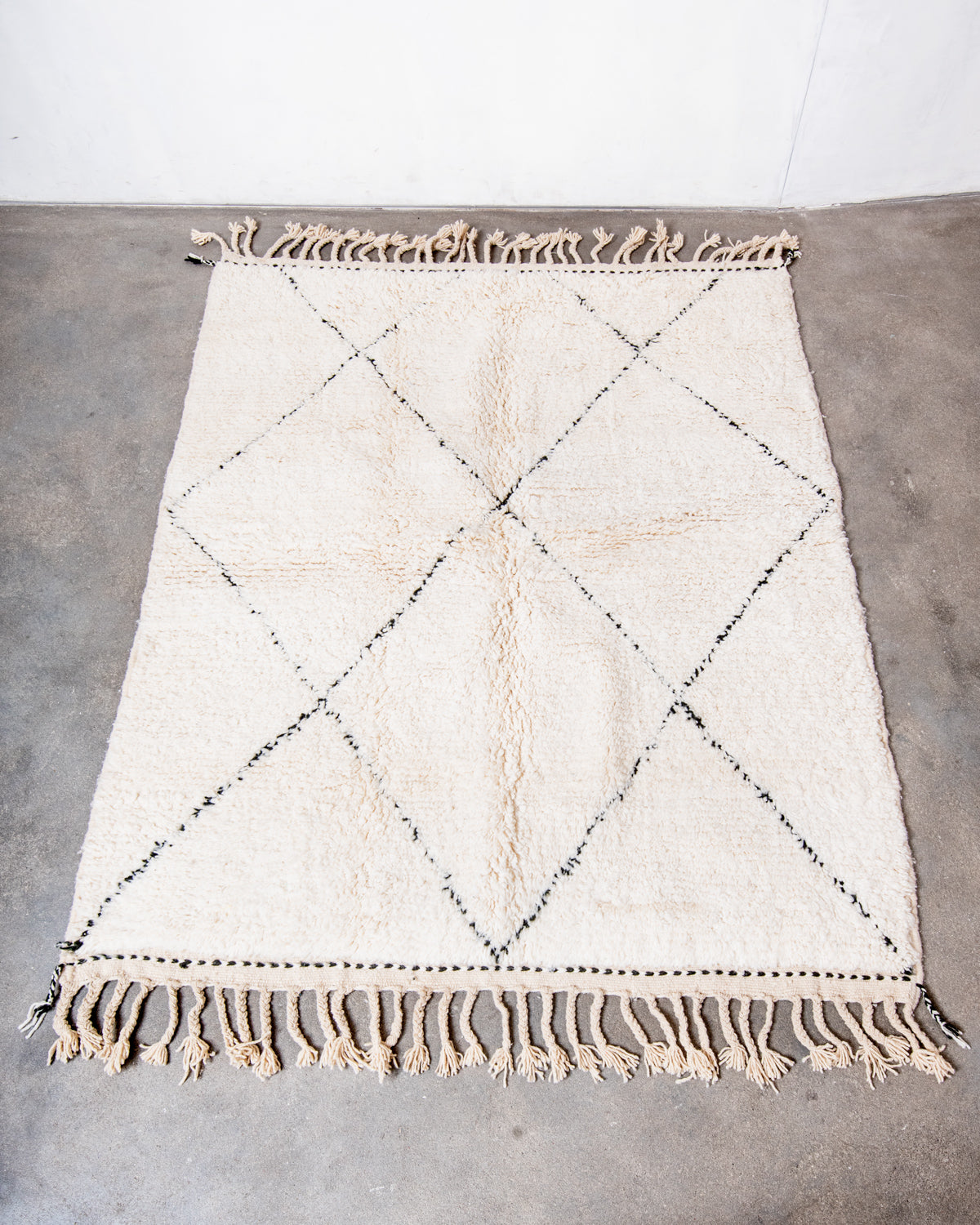 Modern, designer, handcrafted Berber rug from Morocco. Beniourain carpet with minimalist design, natural wool pile and a fluffy texture.